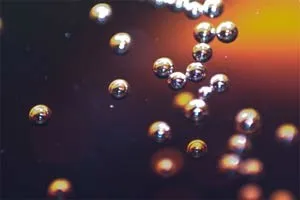 Close-up of bubbles rising in cider