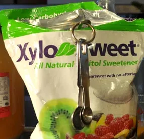 A bag of XyloSweet xylitol with a measuring spoon